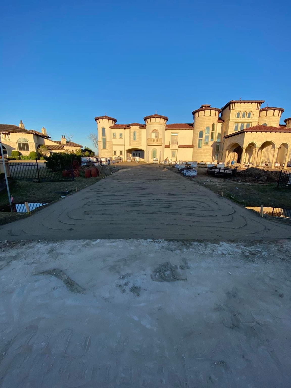Before view of a prepared driveway base at a large home in Richmond, Texas